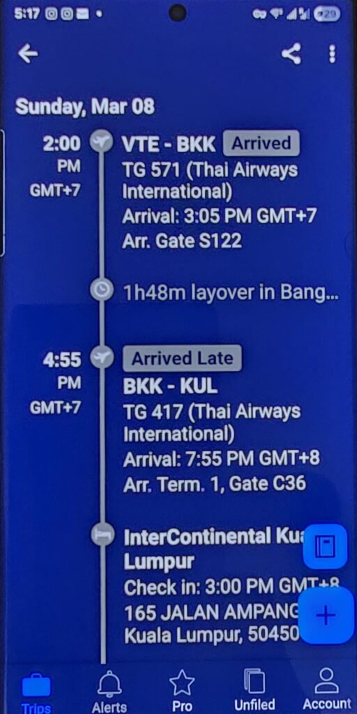 TripIt Pro showing flight itinerary Bangkok to Kuala Lumpur - travel apps for slow travel